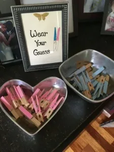 Decorative setup for a gender reveal baby shower with fun themes and ideas