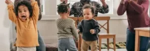 Parent and child enjoying 21 engaging toddler songs with movements.