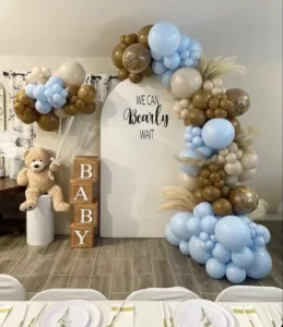 Teal balloons at a baby boy baby shower with fun themes and decorations.