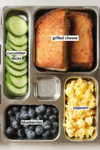 Colorful bento box lunch with healthy foods for kids