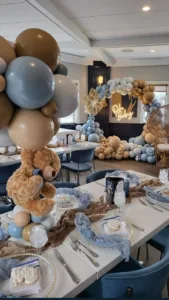 Decorative bears baby shower setup with themed elements and sweets.