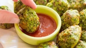 Plate of gluten-free Broccoli Tots served with dipping sauce