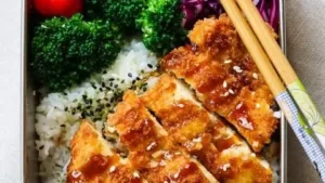 Delicious Chicken Katsu Bento Box with rice and vegetables