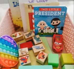Colorful toddler morning basket filled with toys and learning materials.