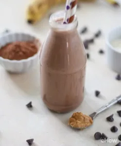 Homemade protein shakes for kids with fruit and yogurt in blender.
