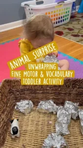 Montessori activity for toddlers focusing on animals, fine-motor skills, and sensory play.