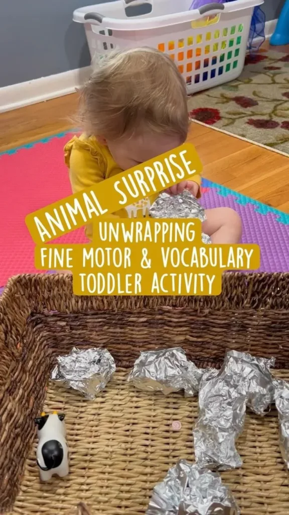 Montessori activity for toddlers focusing on animals, fine-motor skills, and sensory play.