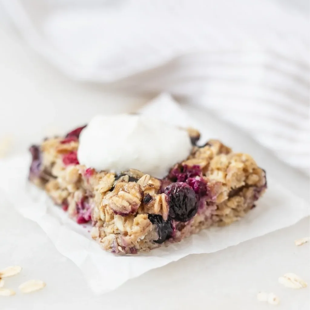 Healthy no sugar banana berry baked oatmeal in a baking dish