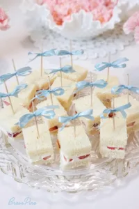 Delicious strawberry tea sandwiches for a coquette party setting