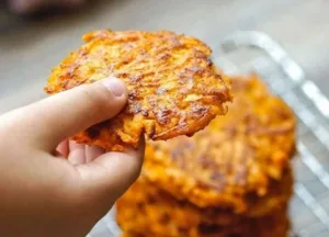 Homemade sweet potato fritters served as finger food for babies and toddlers.