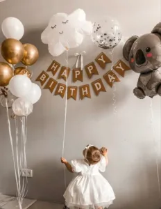 Colorful decorations and cake at a unique first birthday party theme celebration.