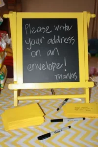 Yellow and grey themed baby shower party setup with elegant decorations.