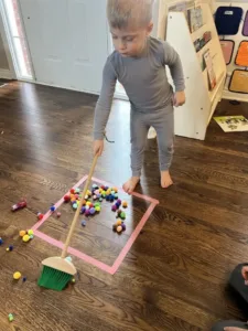 A joyful toddler engaged in high-energy activities outdoors.
