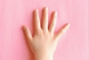 Kids creating handprint bunny crafts for Easter celebrations.