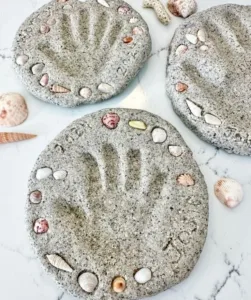 DIY beach sand handprint keepsake ideas under a palm tree