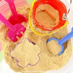 Creative edible play sand made with Cheerios for safe, fun activities