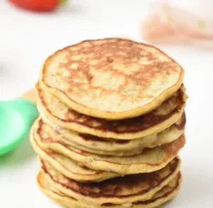 Fluffy egg-free banana pancakes served on a plate, perfect for toddlers.