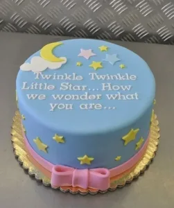 Twinkle Twinkle Gender Reveal Delight cake with pink and blue decorations