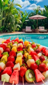 Colorful pool party snacks for kids including fruits, treats, and easy bites.