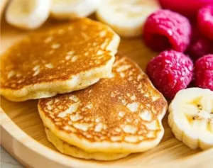 Fluffy banana pancakes served for a happy baby breakfast