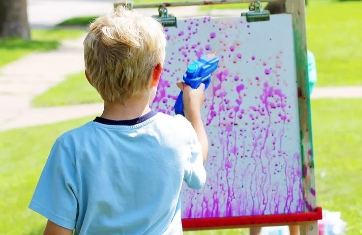 Thrill Your Kids with Colorful Squirt Gun Painting