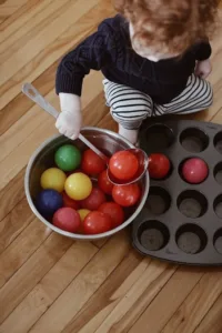 Toddler exploring Montessori play ideas for independence and joy.
