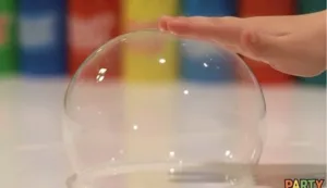 Children experimenting with unpoppable bubbles in a summer science project.