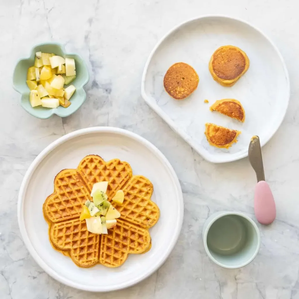 Delicious cozy pumpkin pancakes topped with syrup and spices for breakfast