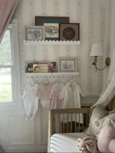 Vintage clothing displayed on scalloped shelves in a kid's room