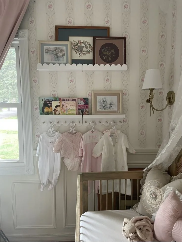 Vintage clothing displayed on scalloped shelves in a kid's room
