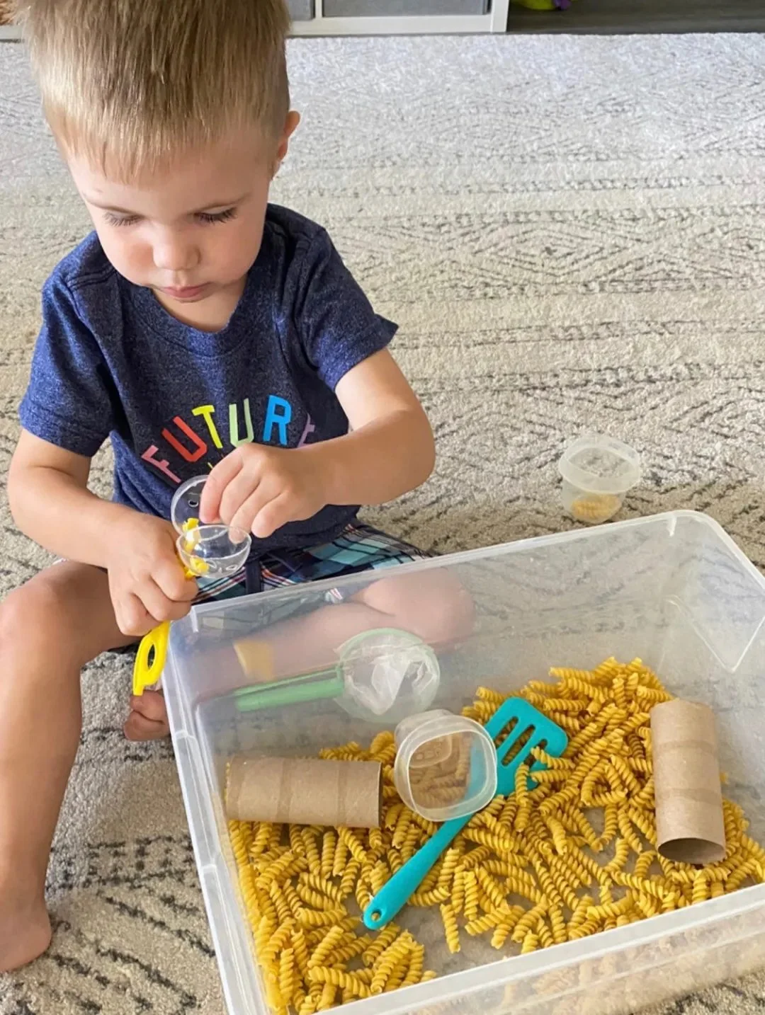 Baby enjoying various busy activities designed for 1-year-olds to enhance stimulation.